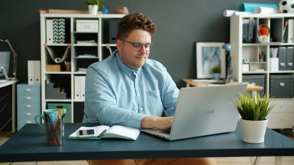 Business owner working on a laptop in a modern office